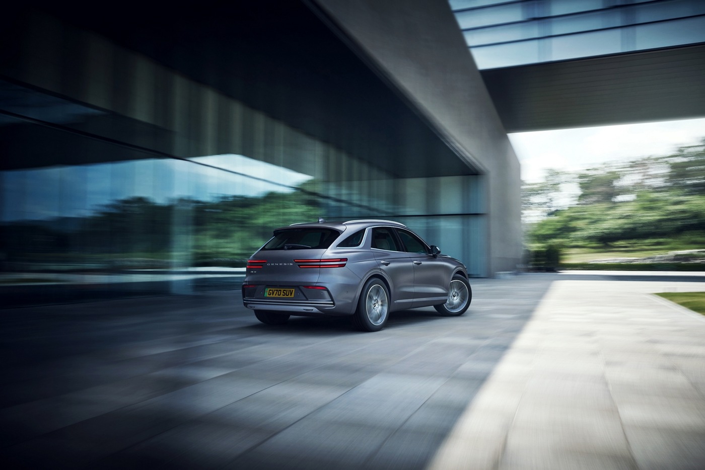 Silver updated Genesis Electrified GV70 driving on a UK road